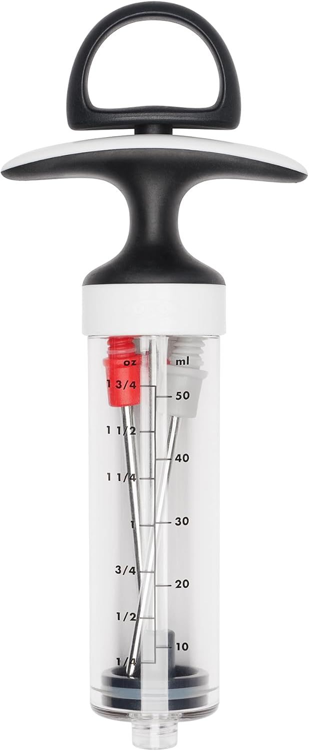 Provides a clean, catalog-style view of the meat injector product showing its full design, handle, plunger, and measurement markings on the transparent barrel.