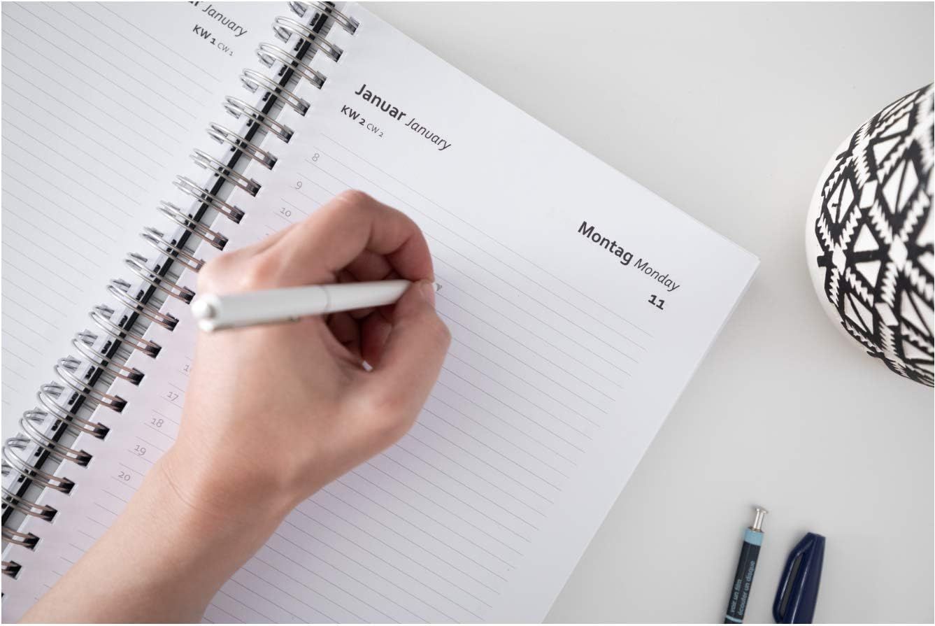 Shows the product being used in a natural, everyday setting to help shoppers visualize how the planner fits into their daily routine.
