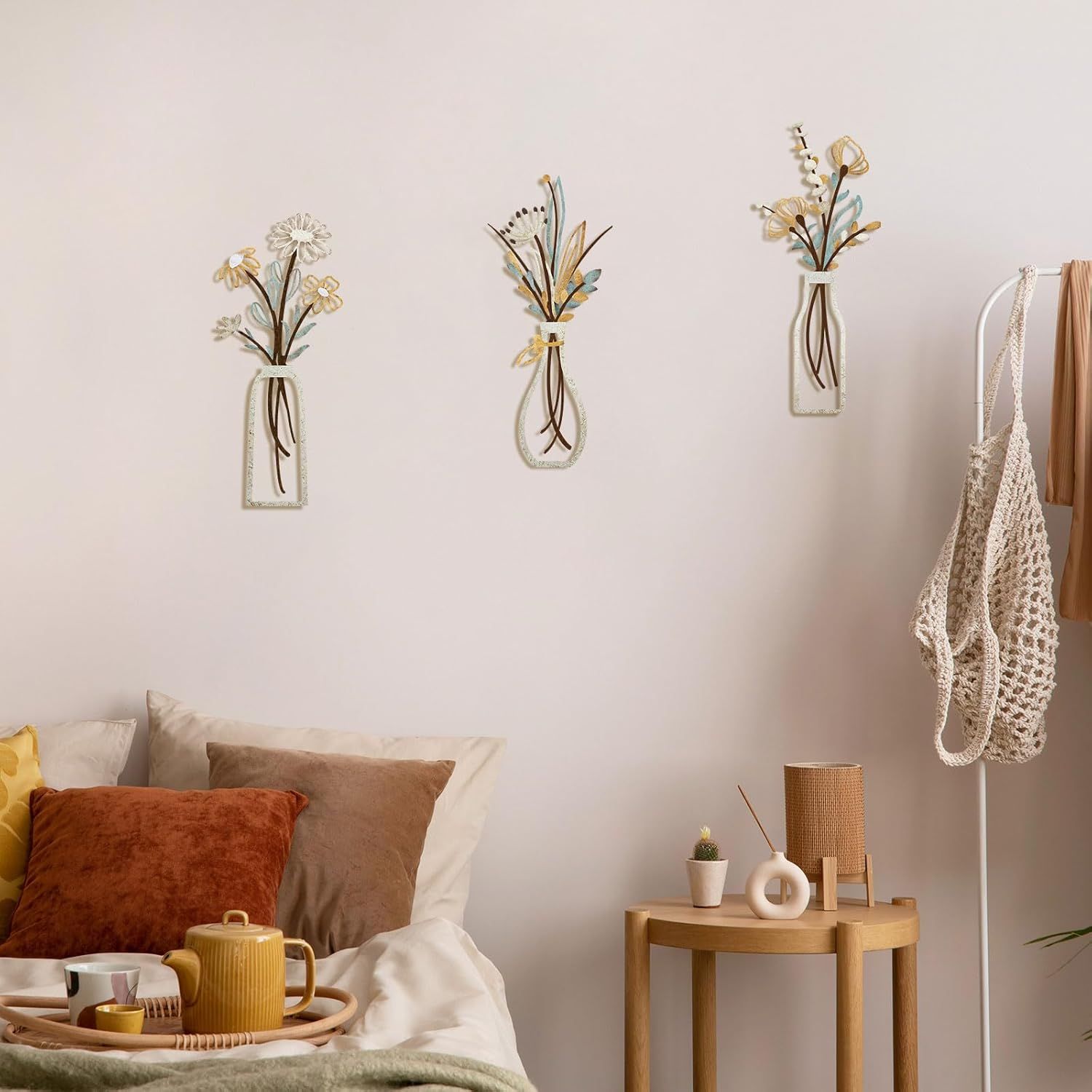 Presents the wall decor in a bedroom setting to demonstrate its versatility and help shoppers visualize placement in their home.