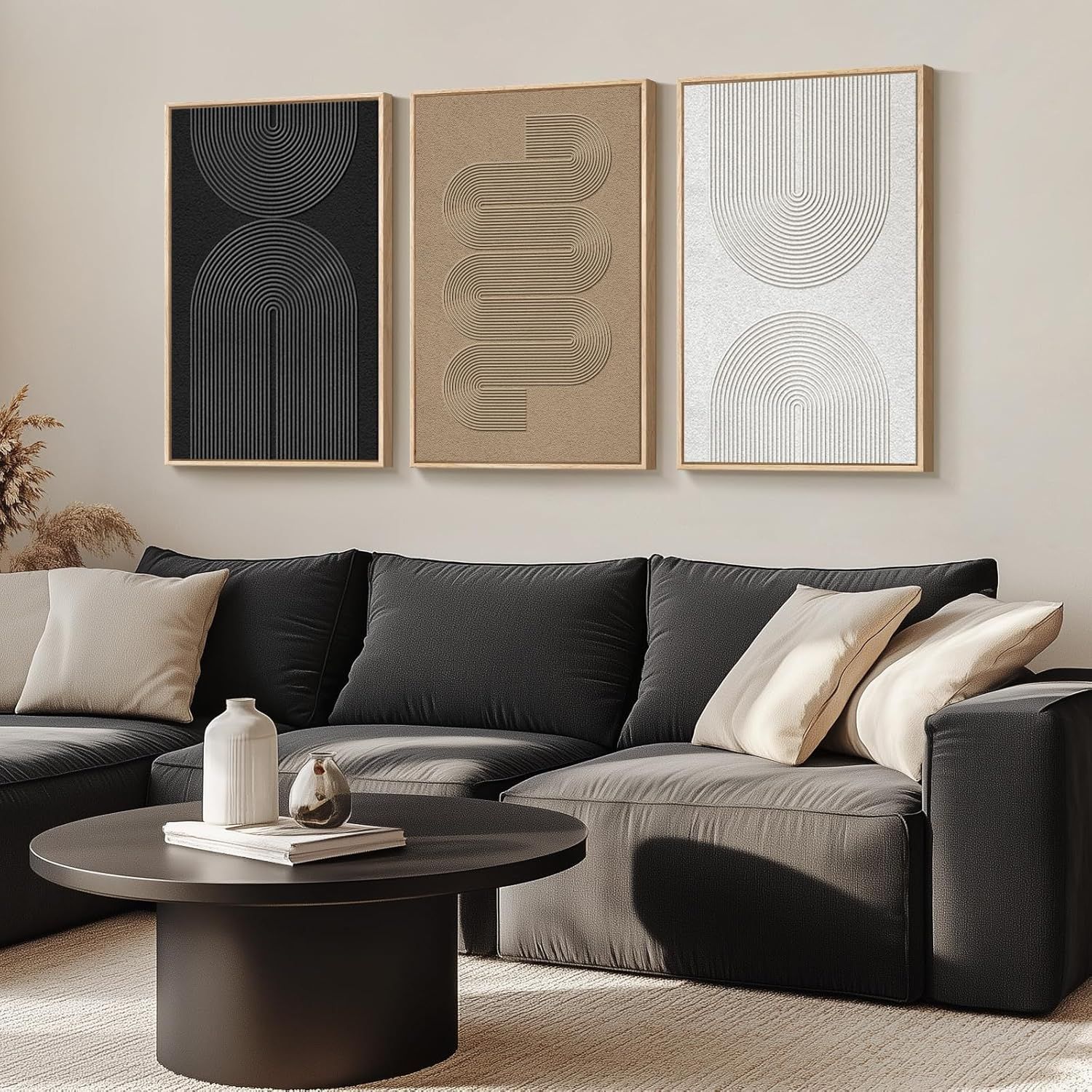 Displays the wall art set in a living room setting to demonstrate how the product fits into modern home decor and helps shoppers envision it in their space.