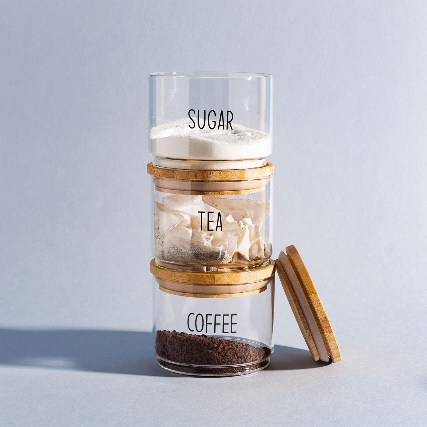 Demonstrates the stackable functionality of the containers to show how they save counter space and provide organized storage.