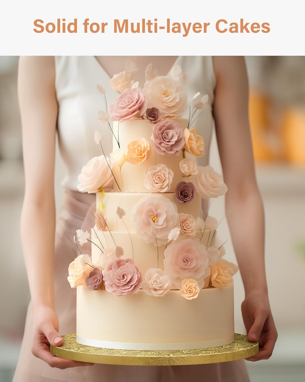 Shows the product in use supporting a large multi-tiered wedding cake, communicating its strength and suitability for heavy, multi-layer cake applications.