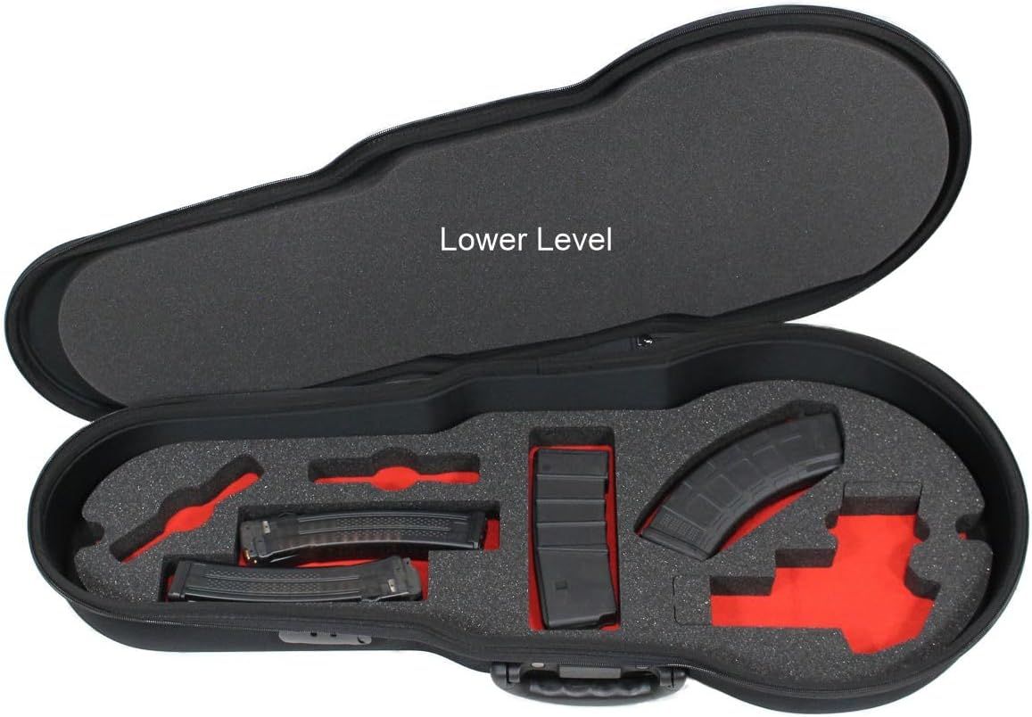 Shows the lower level storage compartment with magazines and accessories organized in custom foam cutouts, demonstrating the full storage capacity and organization system.