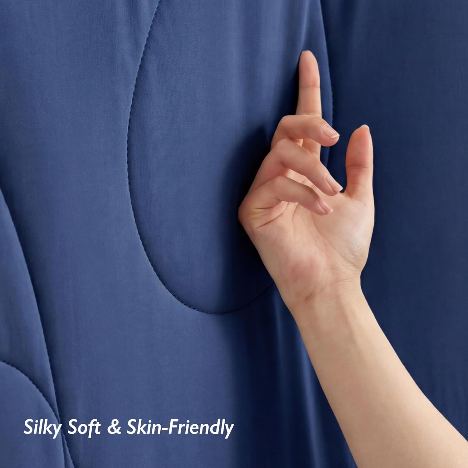 Highlights the luxurious tactile quality and comfort of the fabric through a simple close-up demonstration.