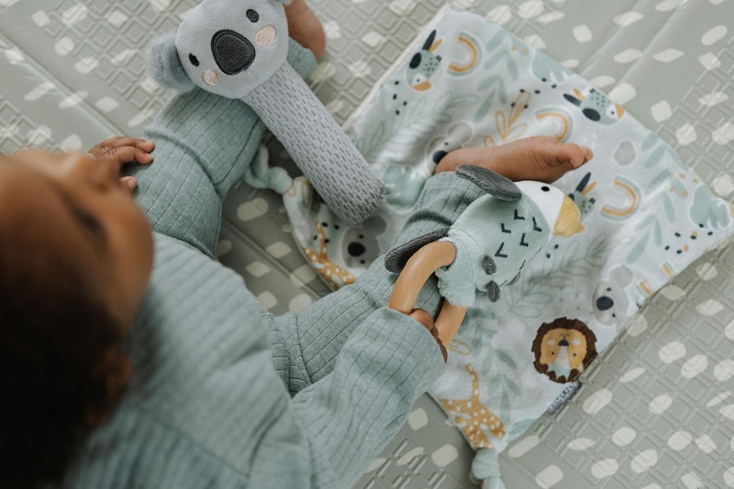 Demonstrates the product in use within a natural home environment to show how babies engage with the toys.
