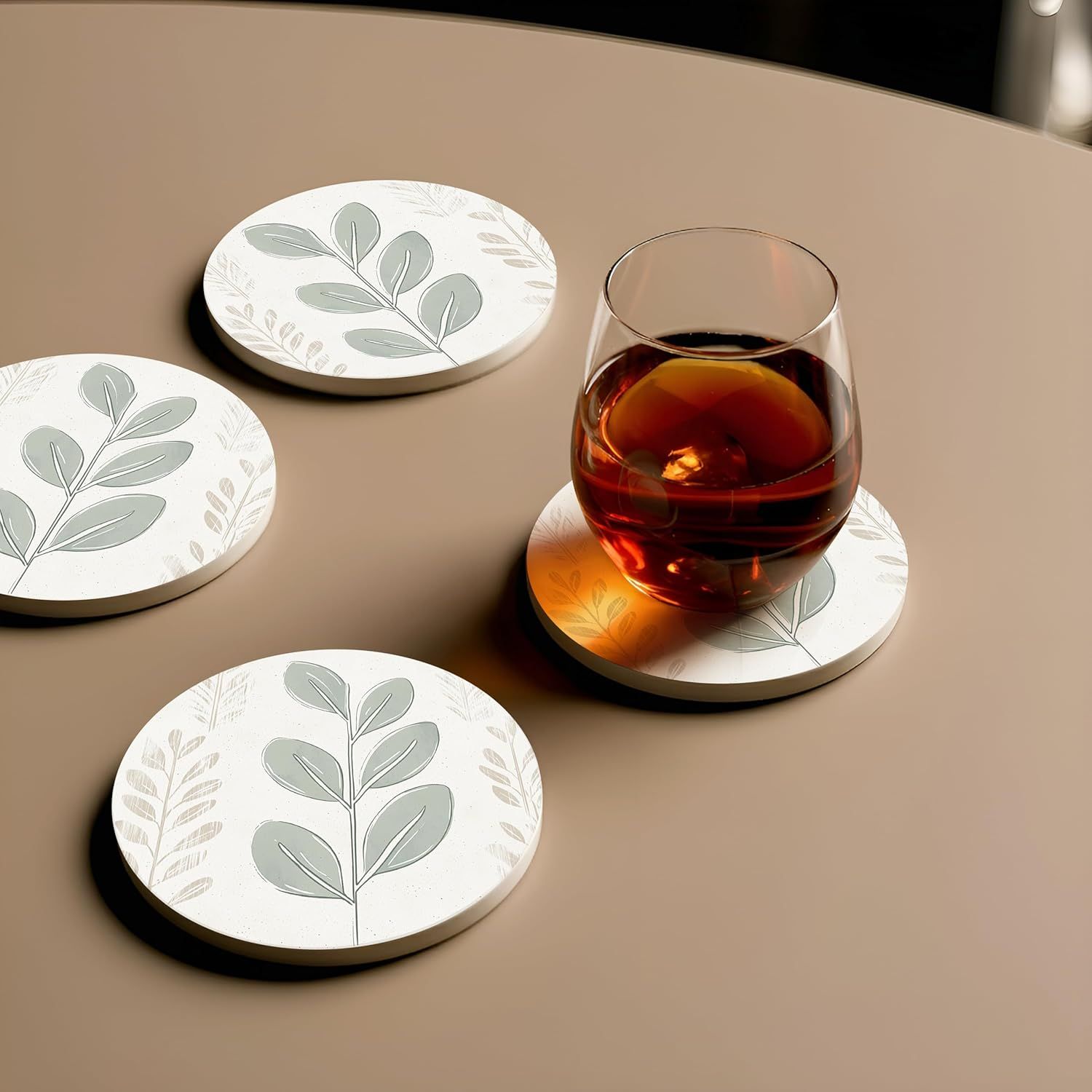 Displays the coasters in a real-world setting with a drink to help shoppers visualize how the product looks and functions in everyday use.