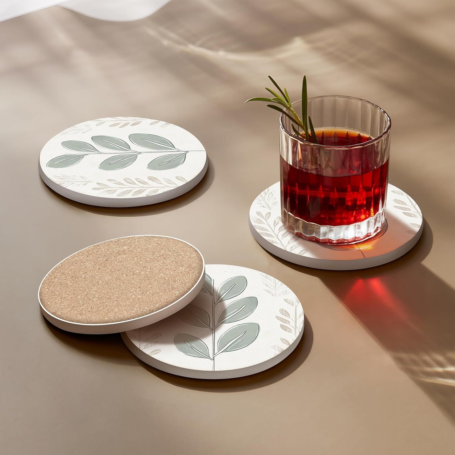 Highlights the physical construction of the coaster by showing the cork backing underneath the decorative surface, demonstrating the dual-layer design and material composition.