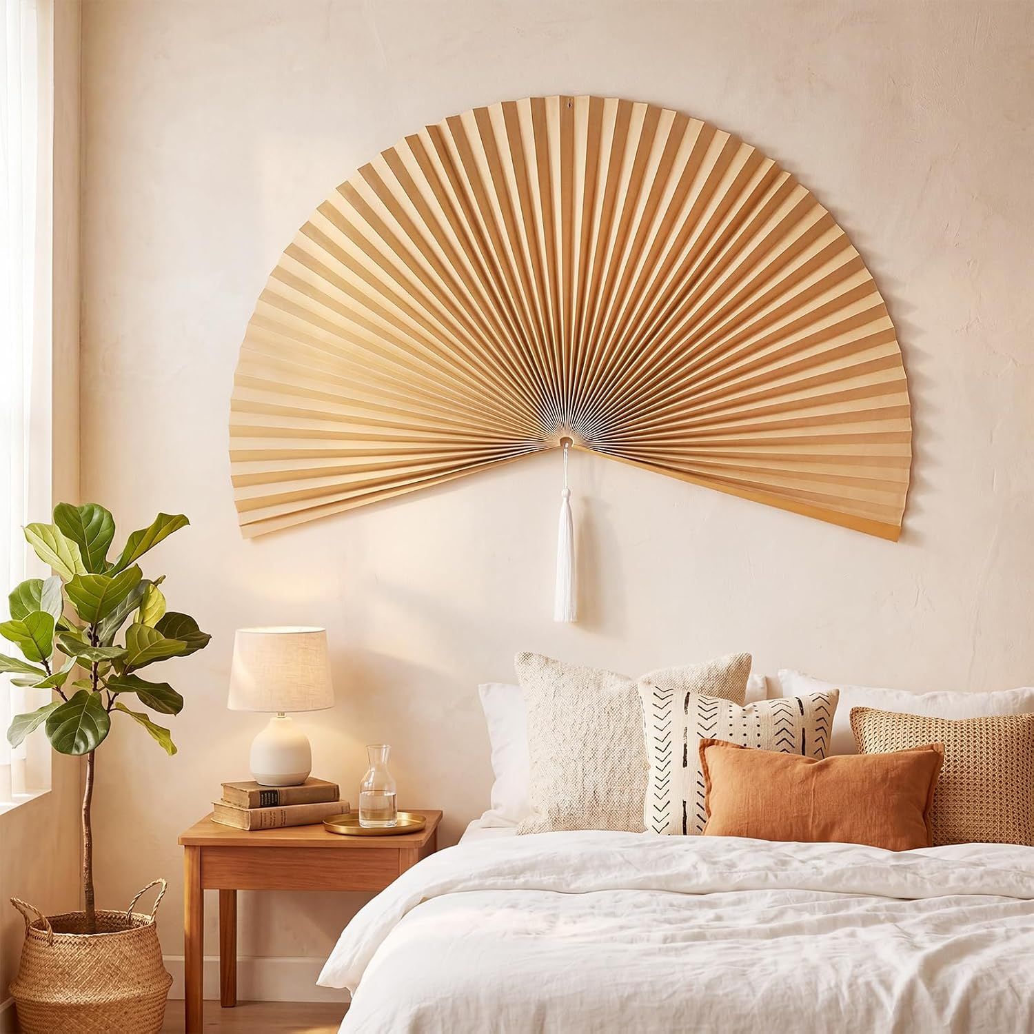 Shows the decorative wall fan in a real-world bedroom environment to help shoppers visualize how the product looks when styled in their home.