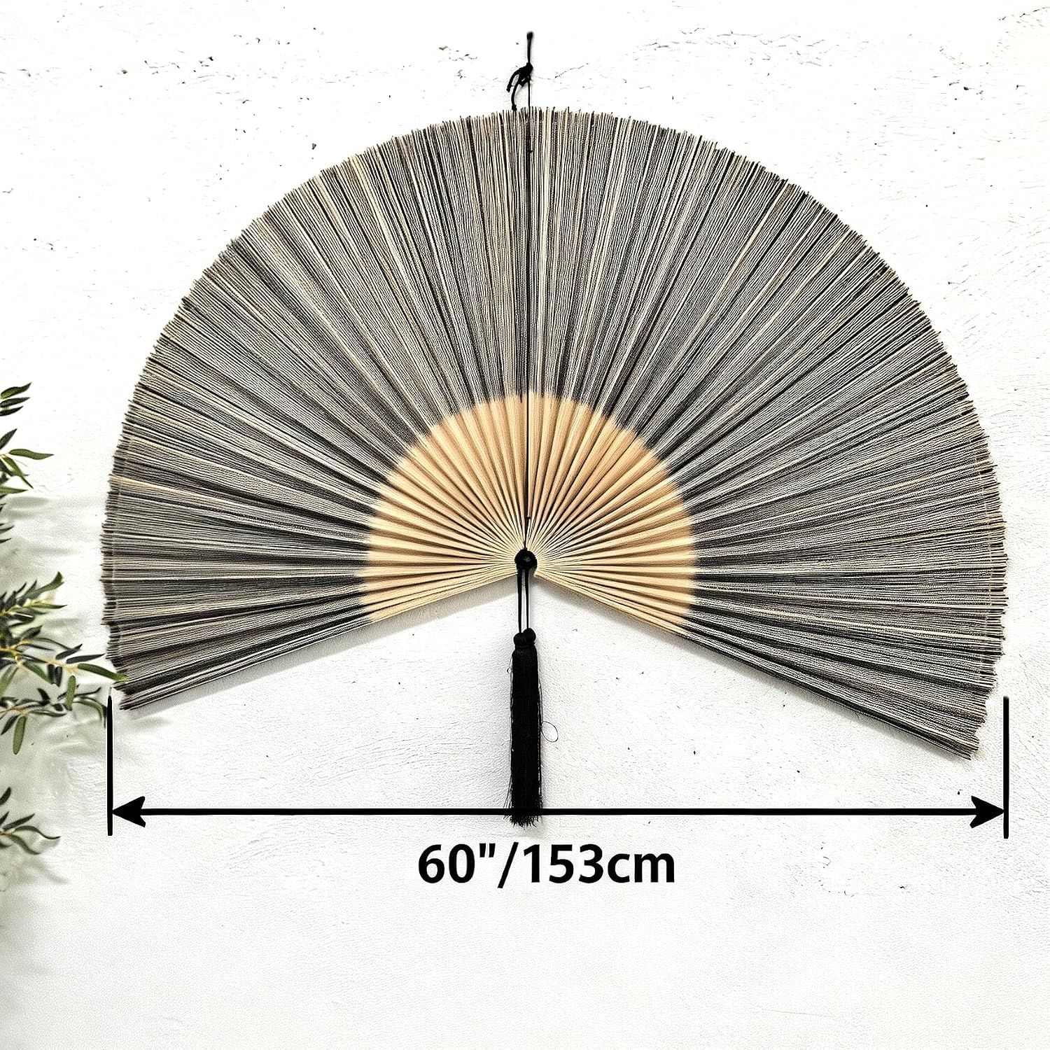 Communicates the physical dimensions of the decorative fan to help shoppers understand how much wall space it will occupy.