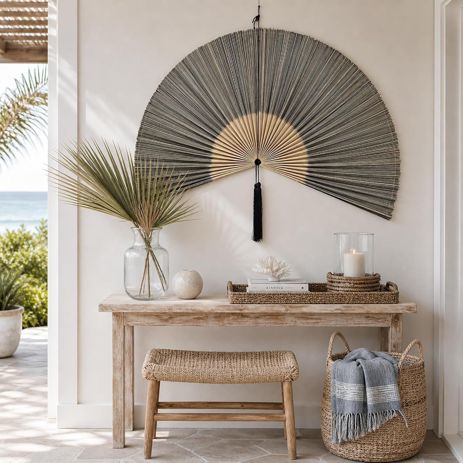 Displays the fan in a coastal-style entryway to demonstrate how it complements natural decor and fits into real home spaces.